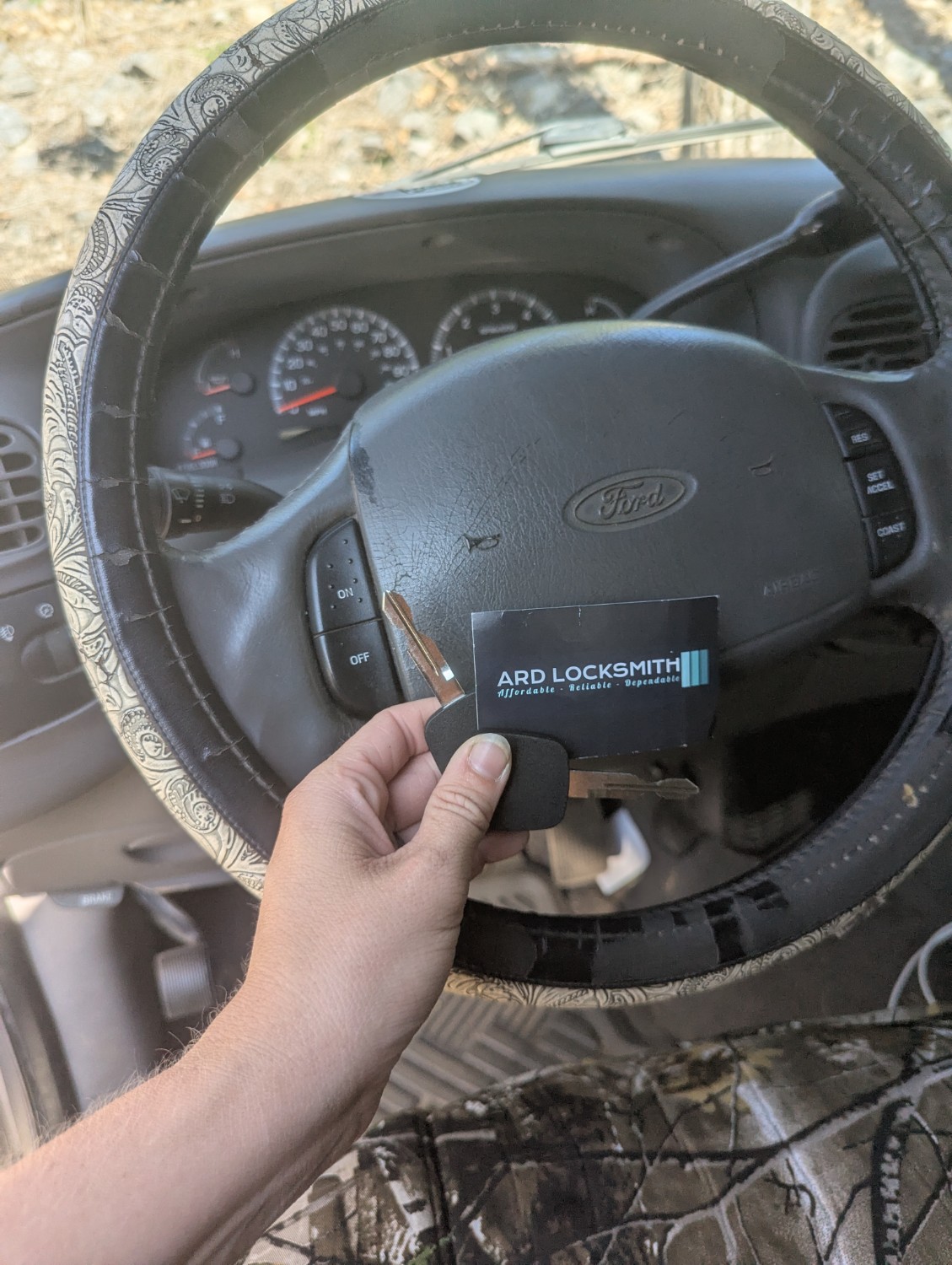 Two Ford transponder keys and ARD Locksmith card with a 2000 Ford F-150 in Benton Arkansas
