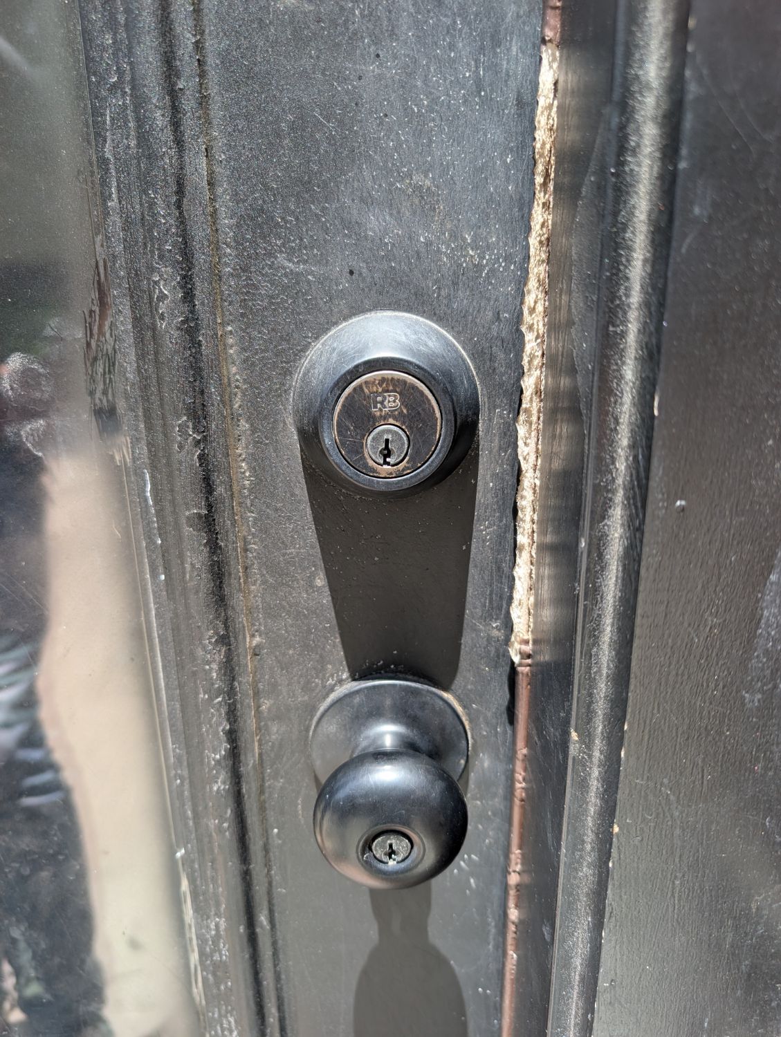 Residential deadbolt and doorknob documented during a multi-lock rekeying job