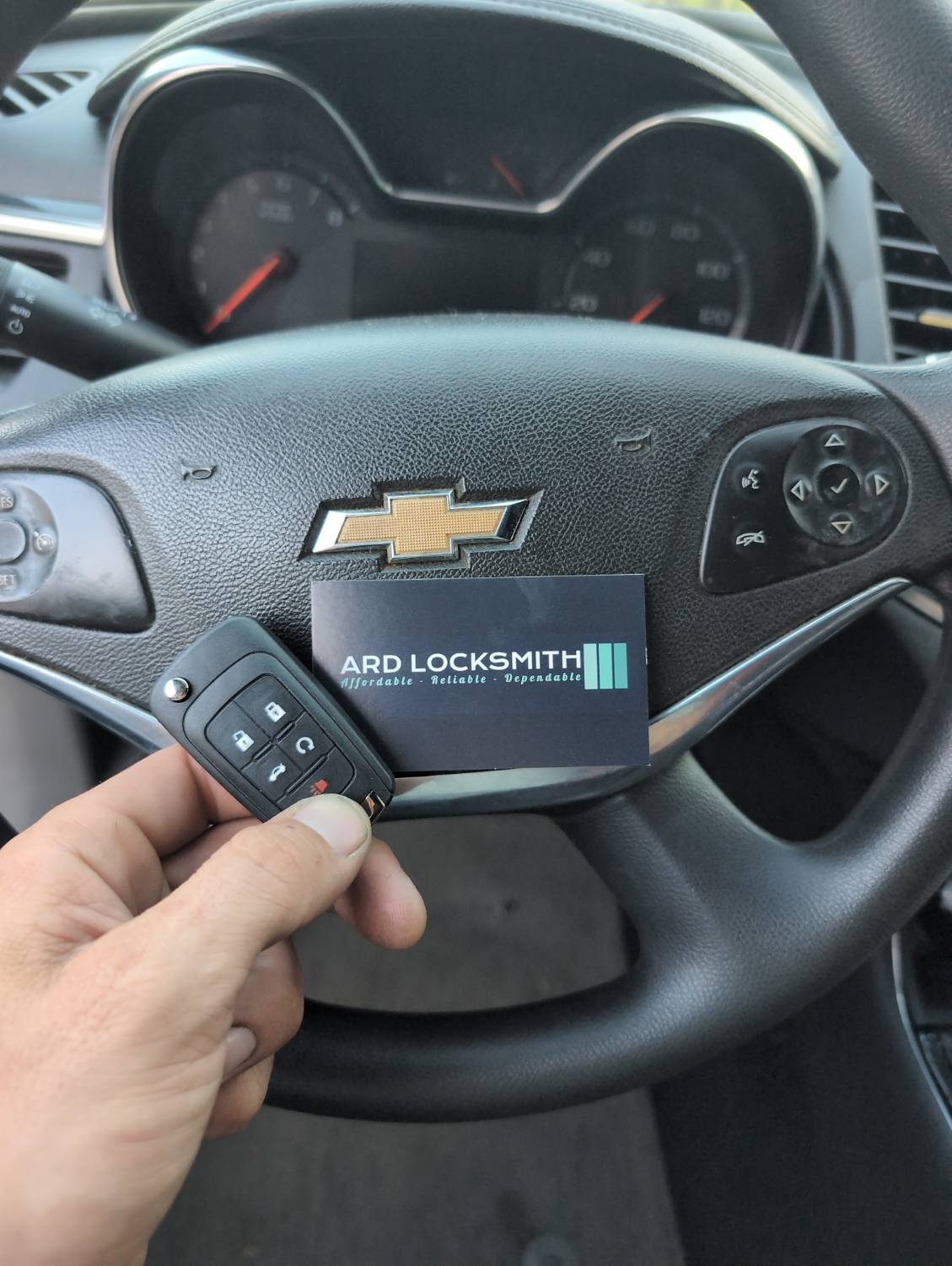 Chevrolet Impala flip key and ARD Locksmith card documented after key service