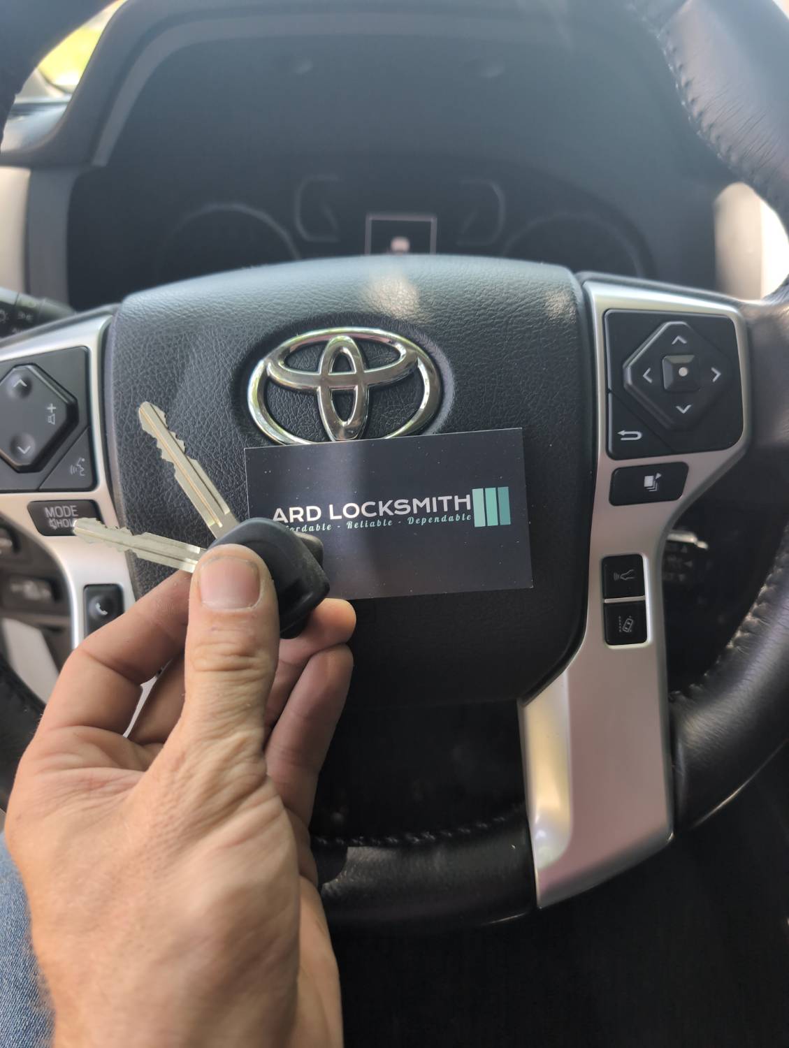 Two Toyota Tundra keys and ARD Locksmith card documented after key service