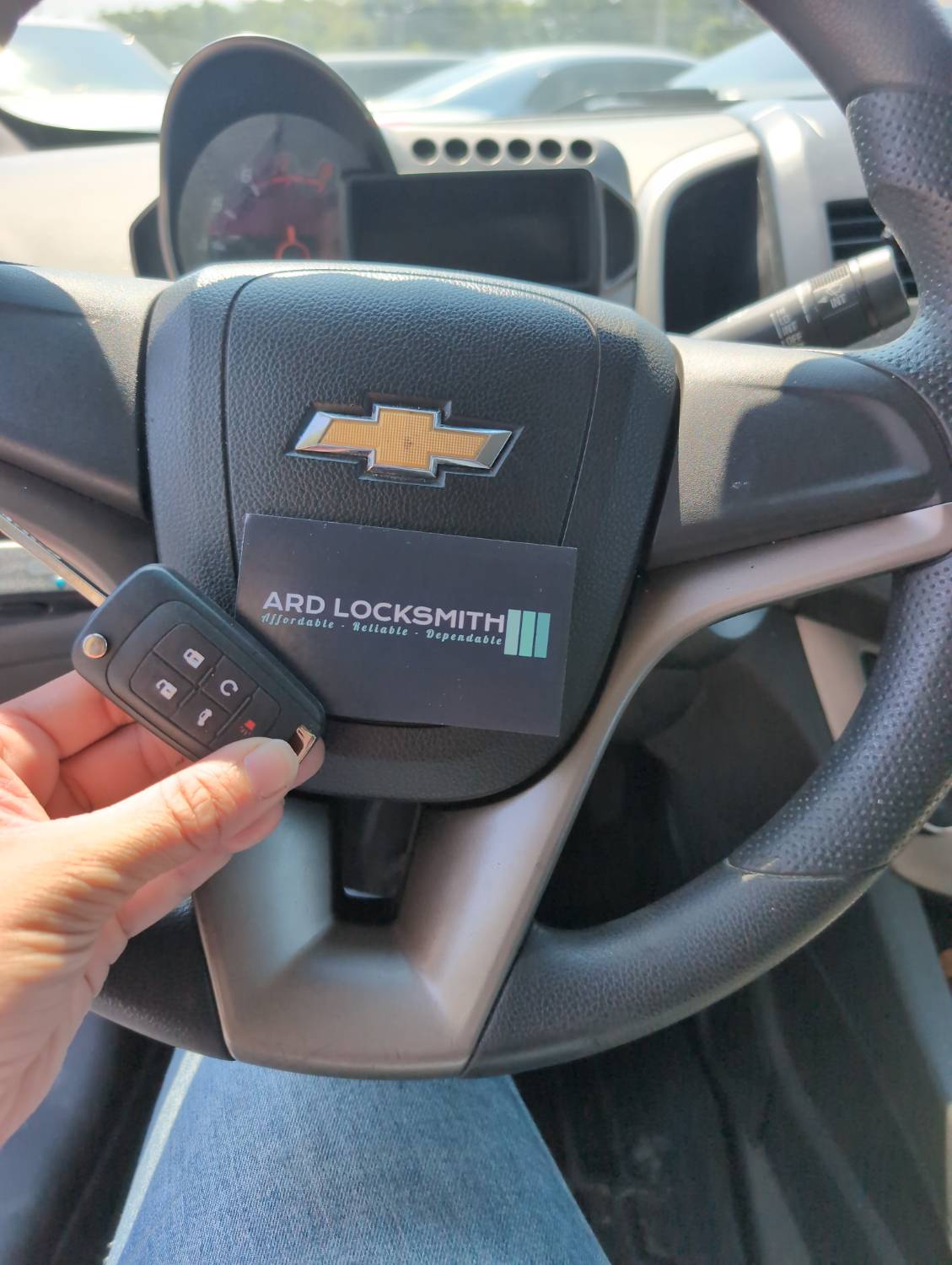 Chevrolet Sonic flip key and ARD Locksmith card documented after all-keys-lost service