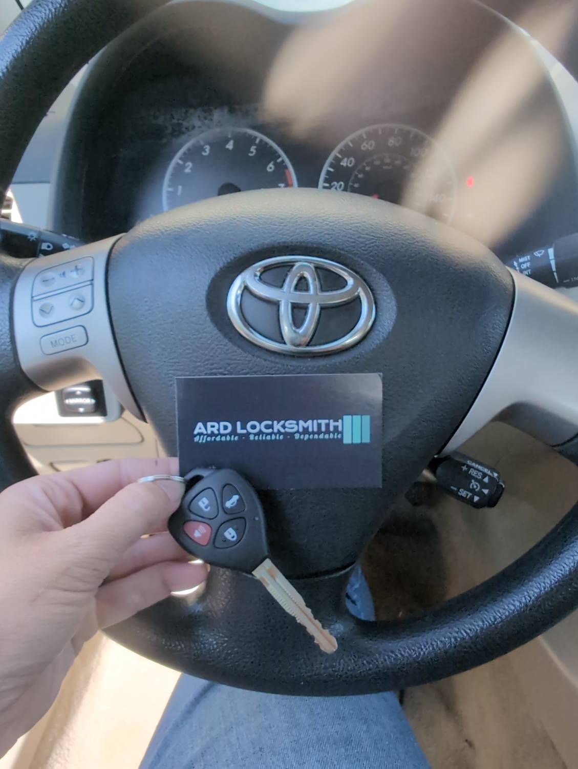 Toyota Corolla remote-head key and ARD Locksmith card documented after replacement