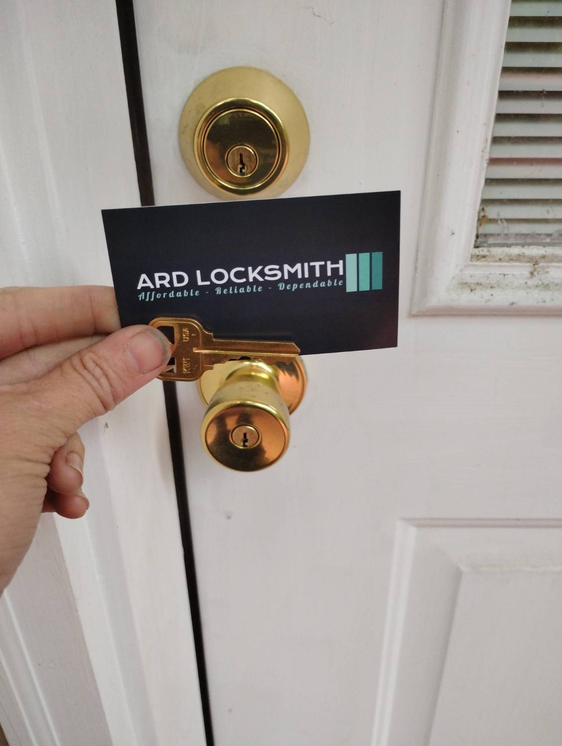 Rekeyed residential door hardware and completed key at a Hot Springs Village home