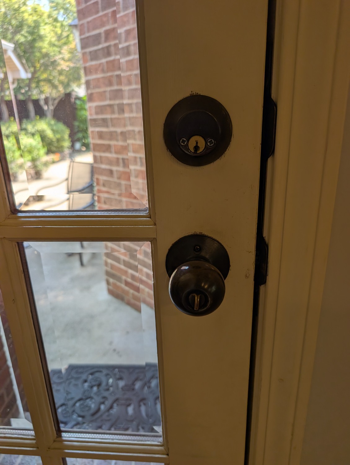 Residential deadbolt and doorknob documented after rekeying service