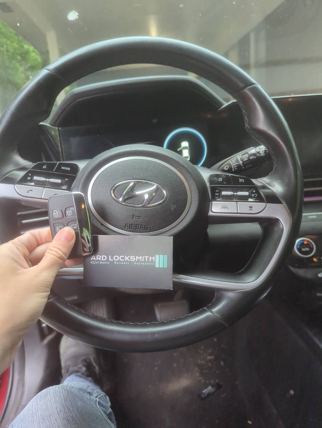 Completed Hyundai smart key documented inside a 2021 Elantra with an ARD Locksmith card