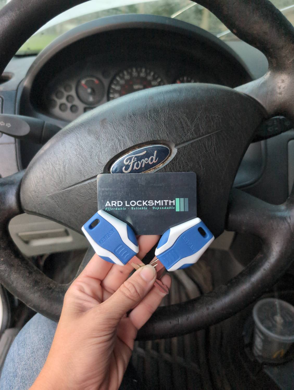 Two completed Ford keys documented inside a 2006 Focus with an ARD Locksmith card