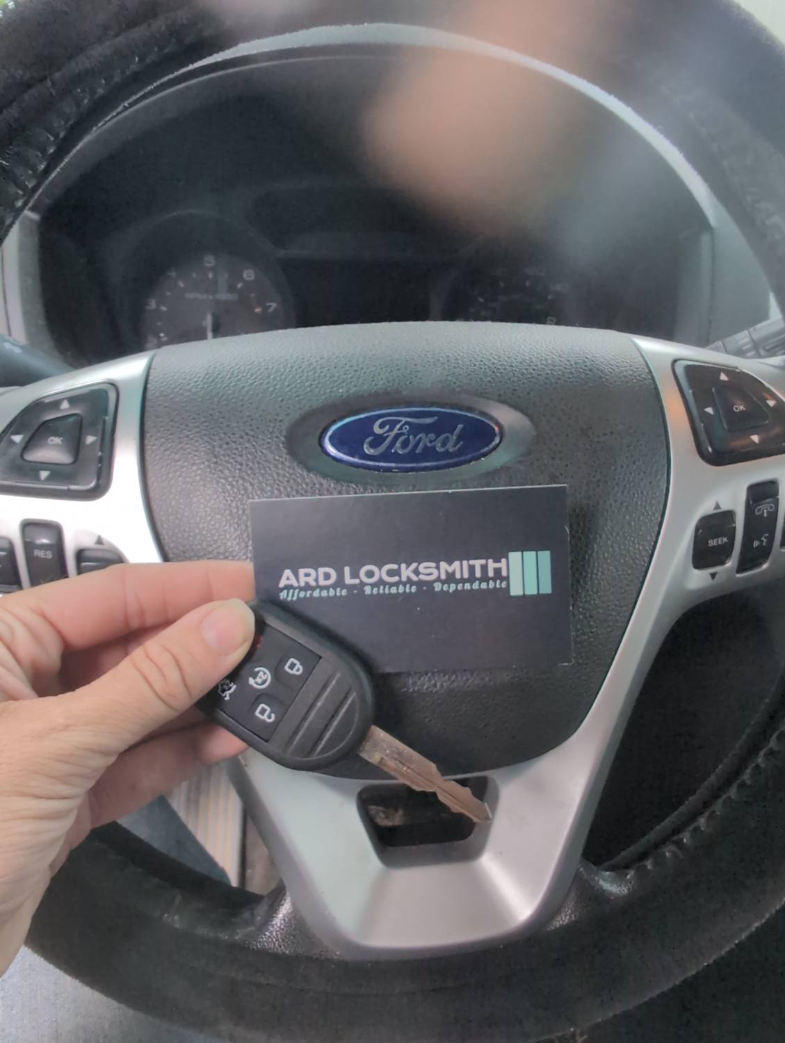 Completed Ford remote-head key documented with an ARD Locksmith card