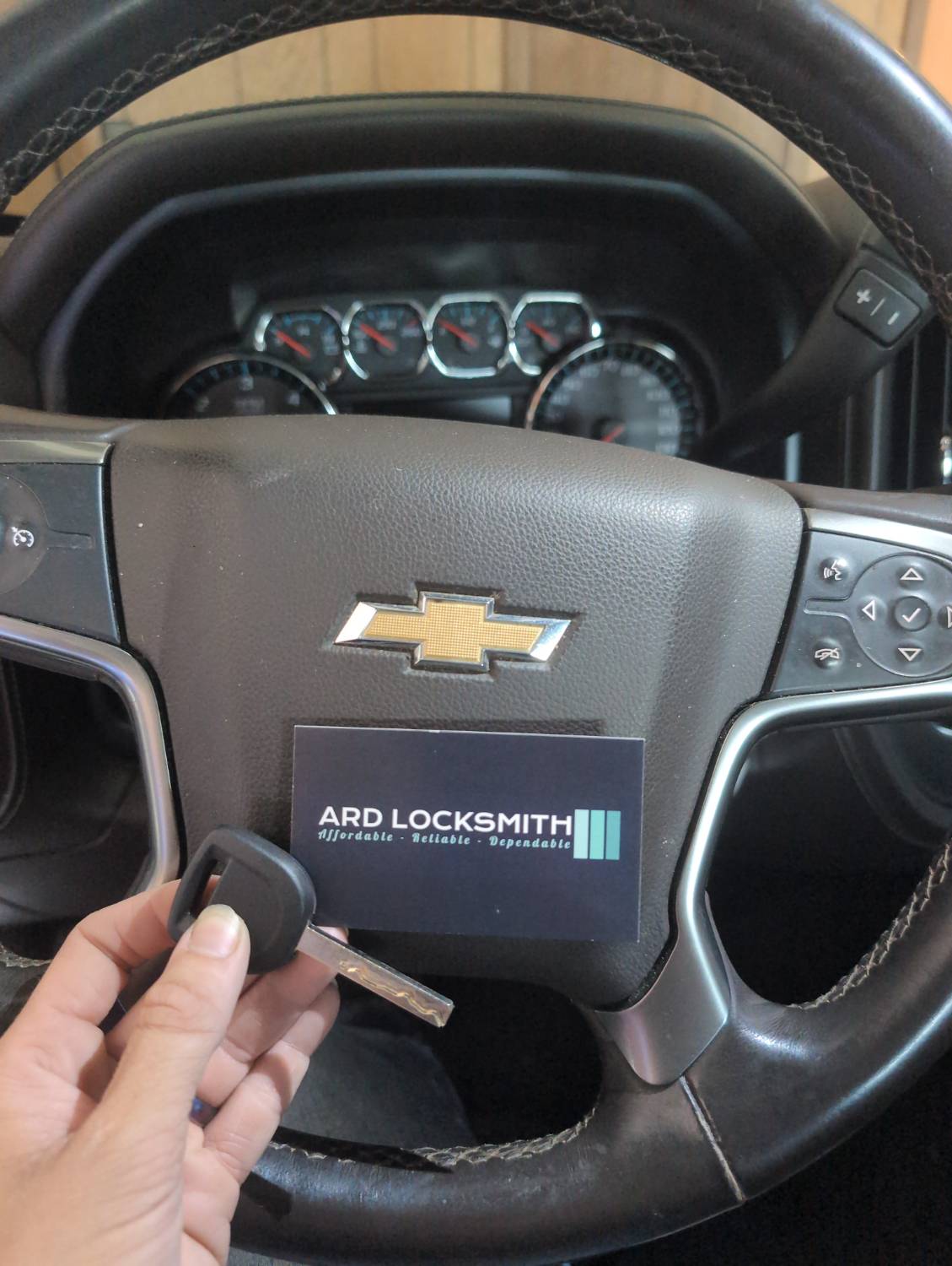 Completed Chevrolet Silverado key documented with an ARD Locksmith card