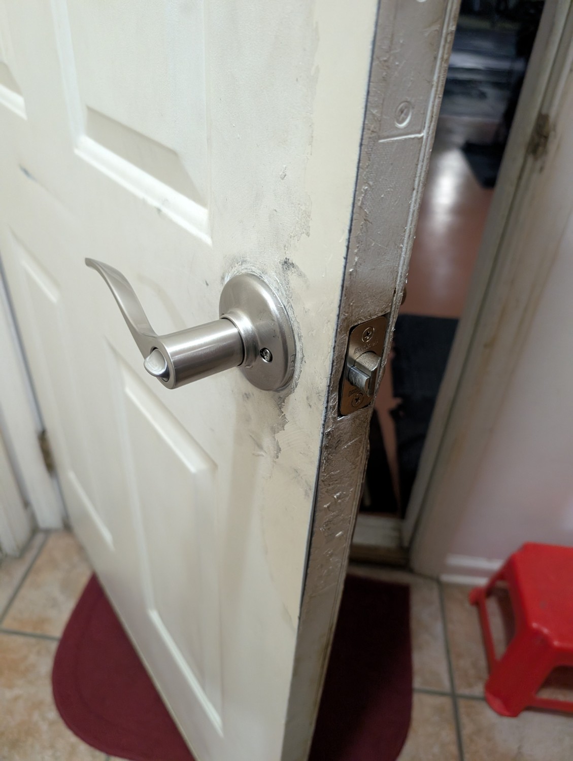 Installed residential lever lock documented on a home door