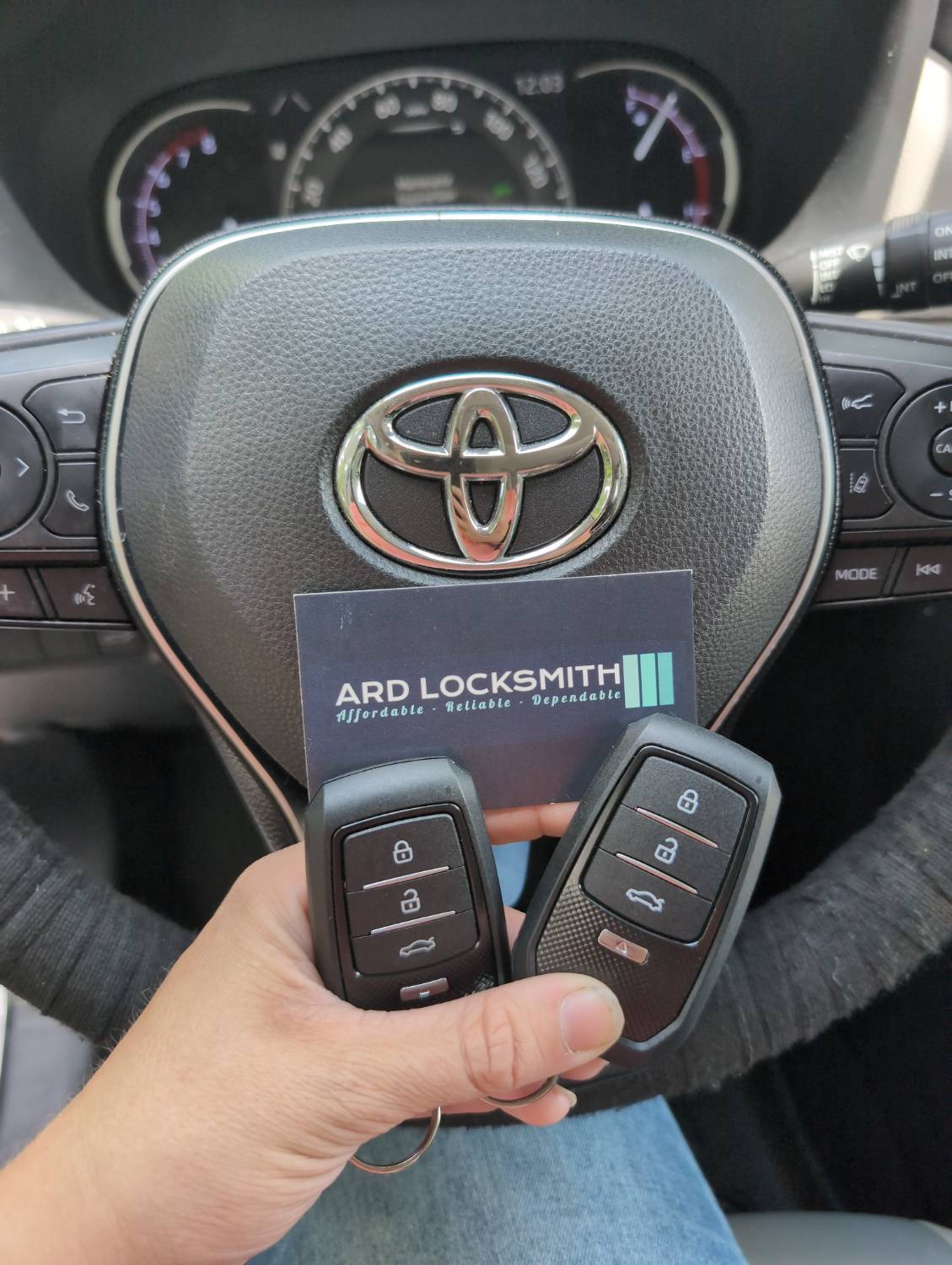 Two Toyota smart keys documented inside a 2019 RAV4 with an ARD Locksmith card