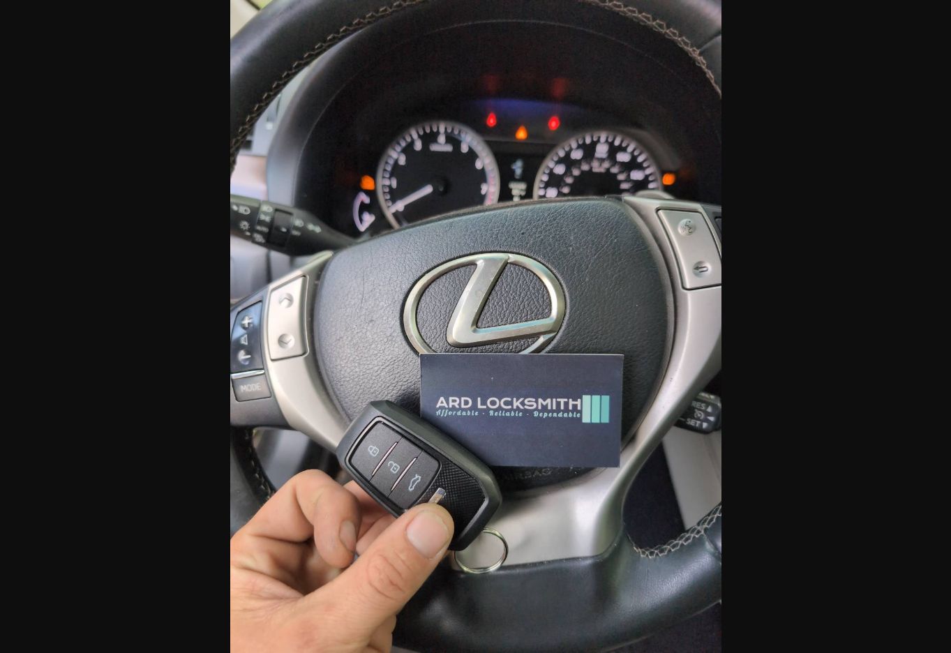 Completed Lexus smart key documented inside a 2013 GS 350 with an ARD Locksmith card