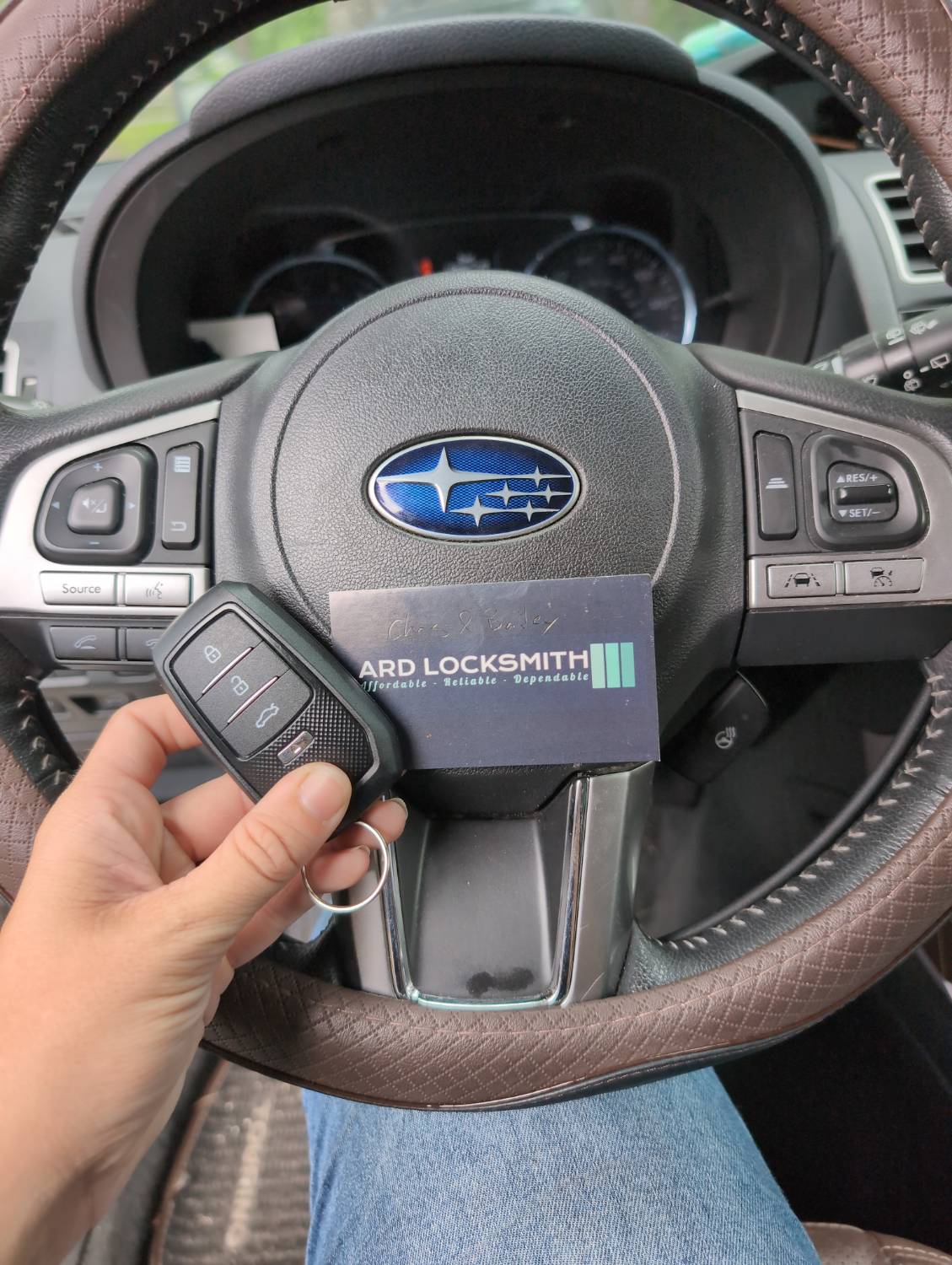 Completed Subaru smart key documented inside a 2018 Forester with an ARD Locksmith card