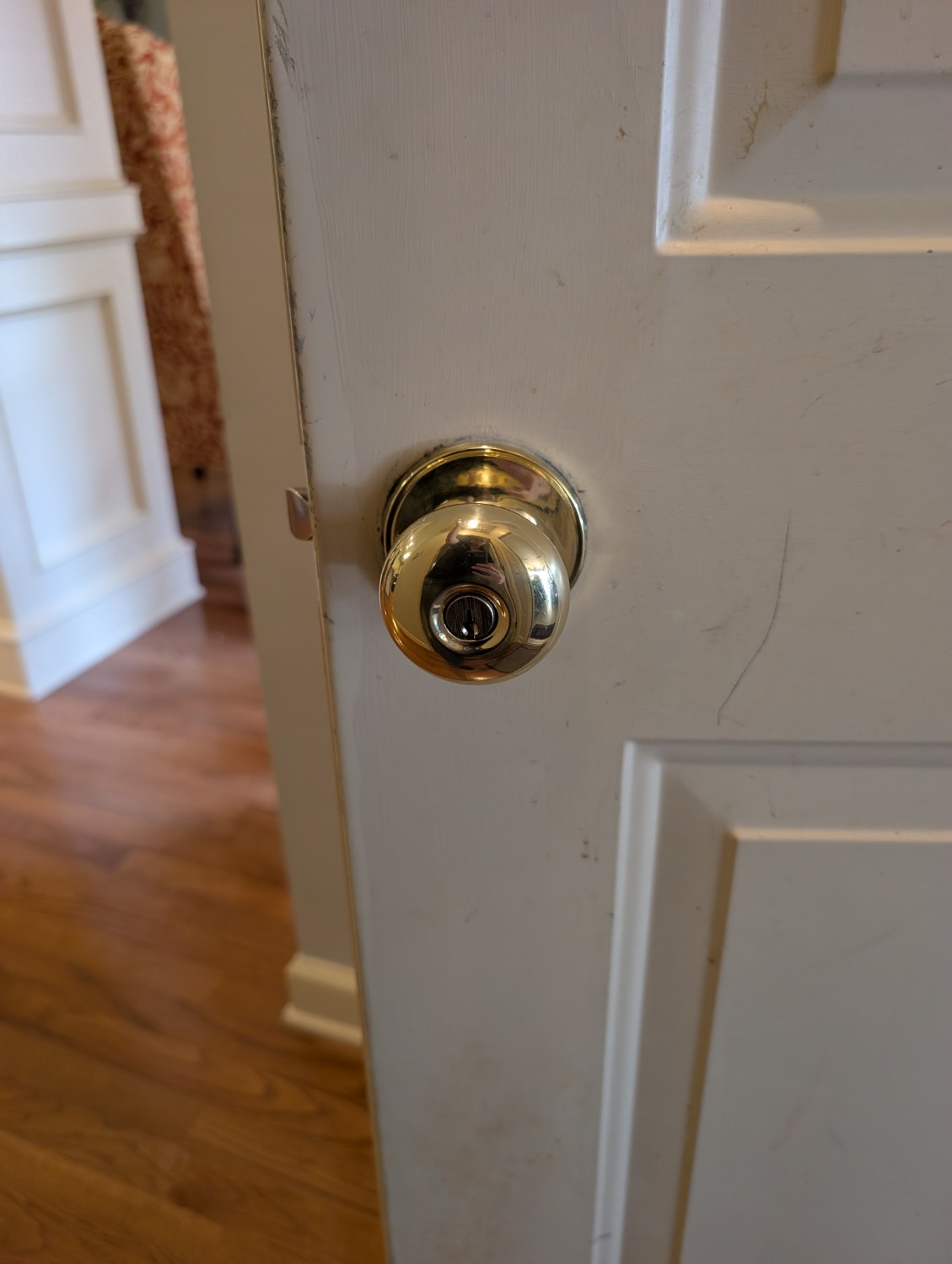 Residential door lock documented during a whole-home rekey service