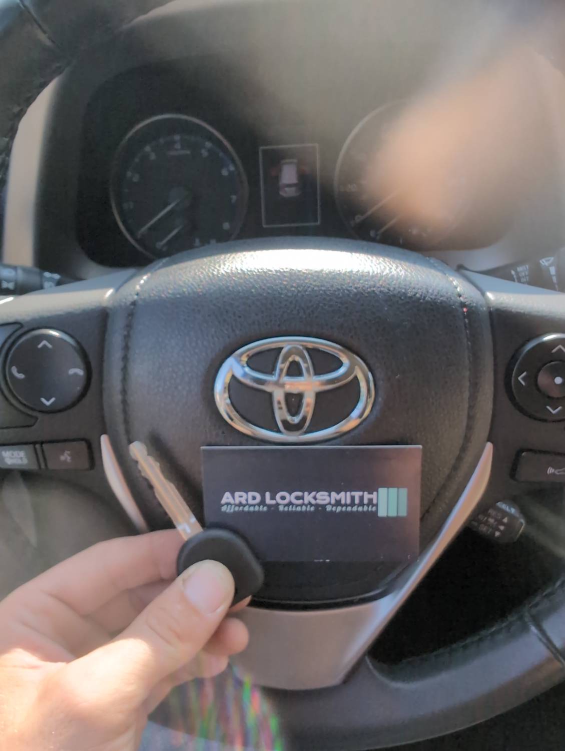 Completed Toyota RAV4 replacement key documented with an ARD Locksmith card