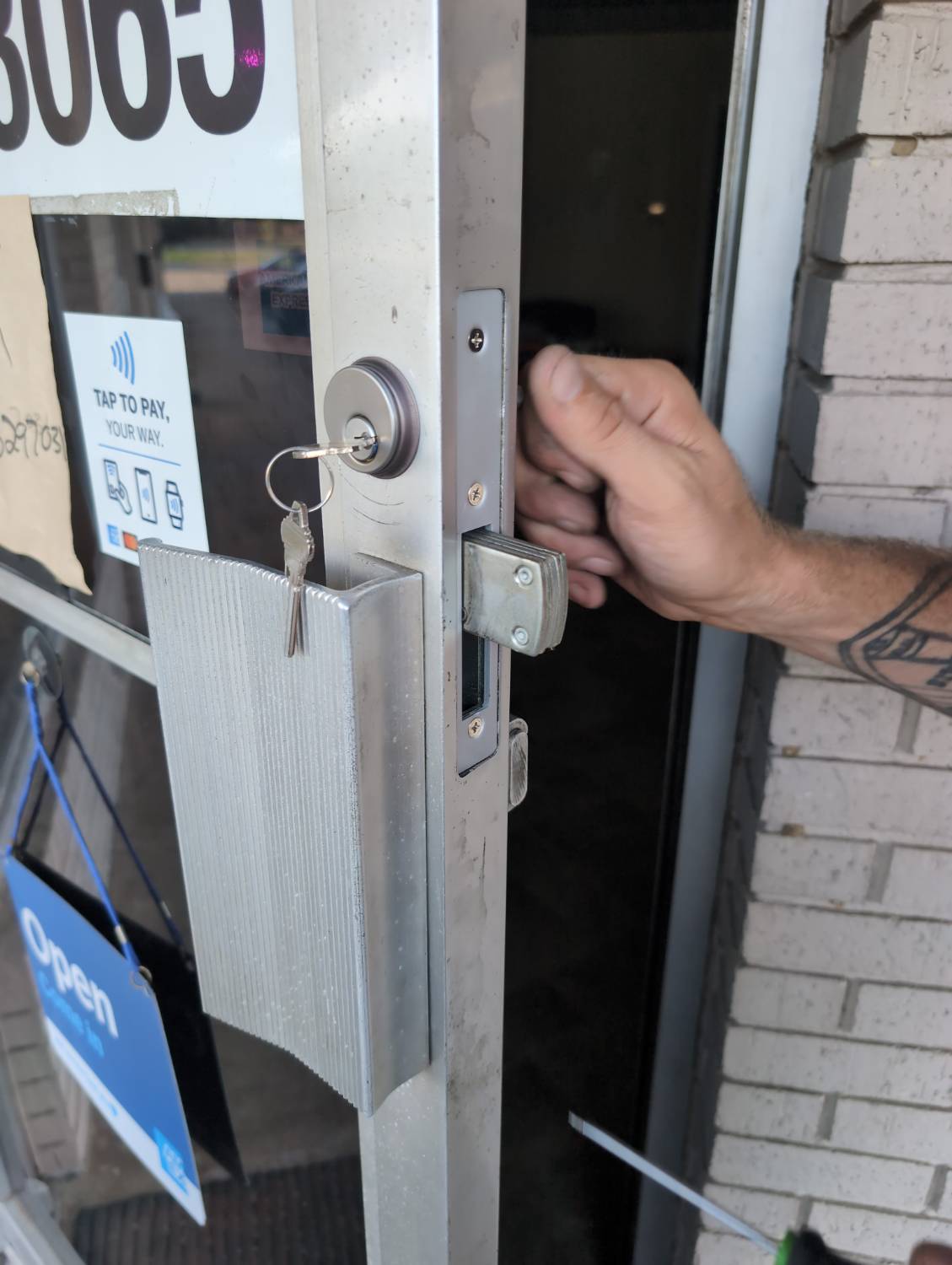 Storefront mortise cylinder documented after replacement with keys in the lock