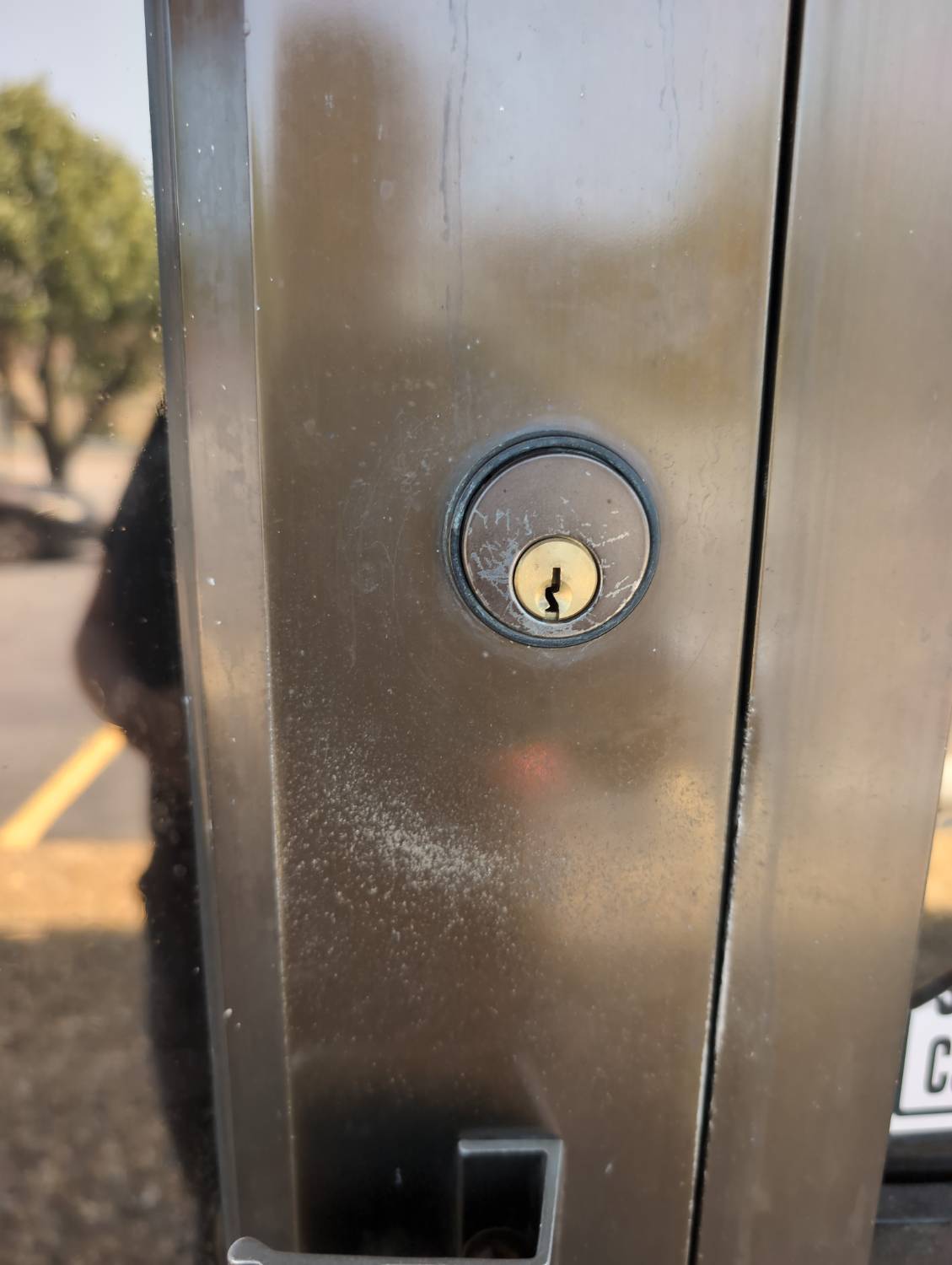 Commercial door lock cylinder documented during a rekey service