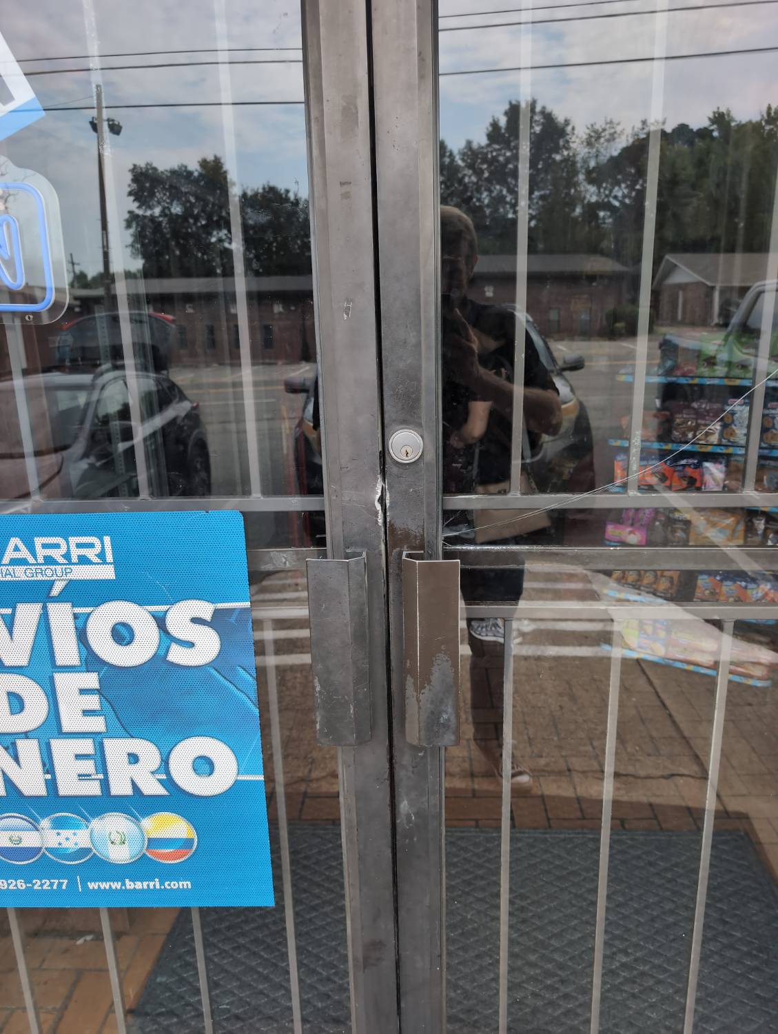 Commercial storefront door documented during lockout and mortise-latch service