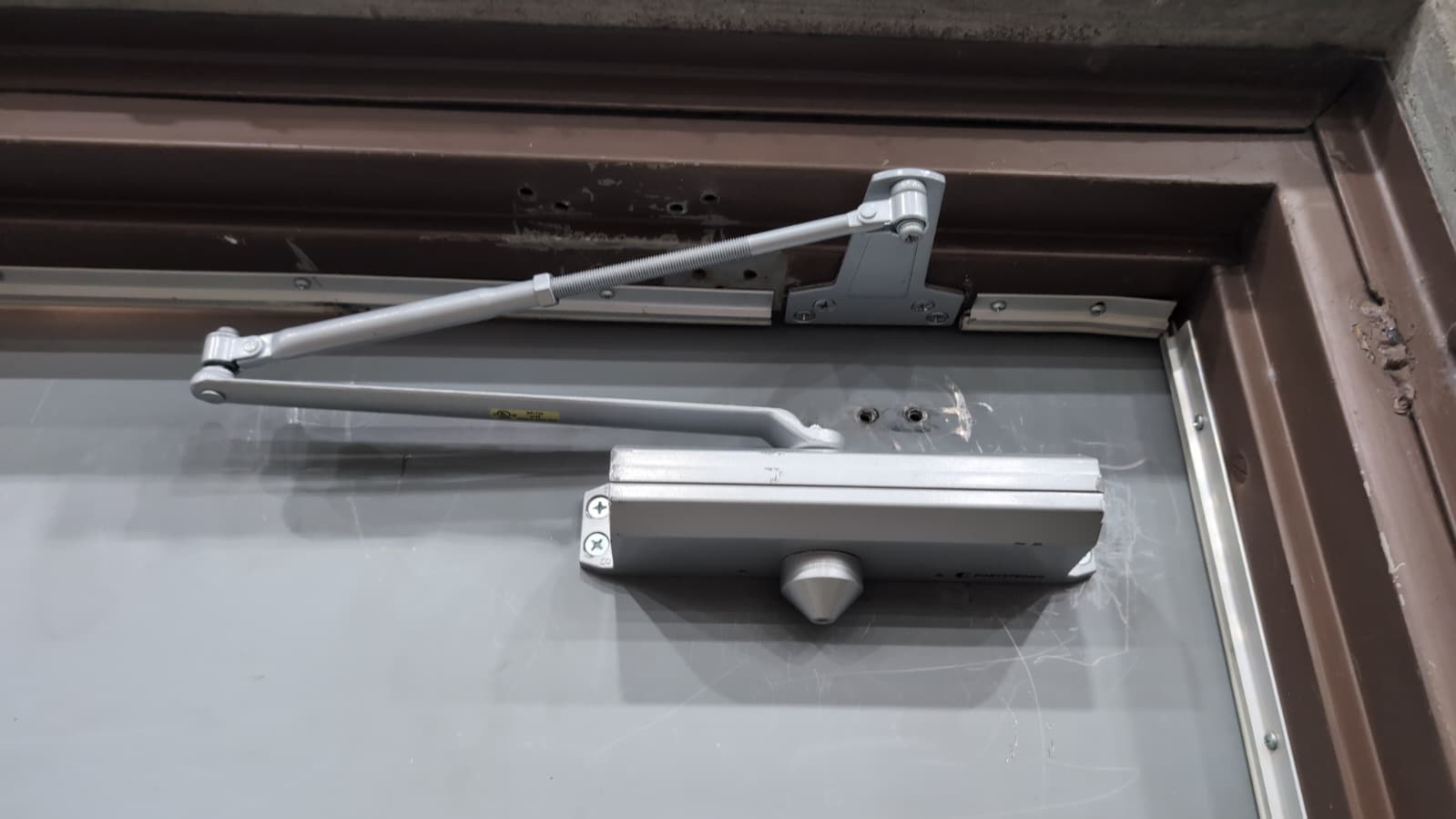 Door closer on a commercial metal door from ARD Locksmith job 9635