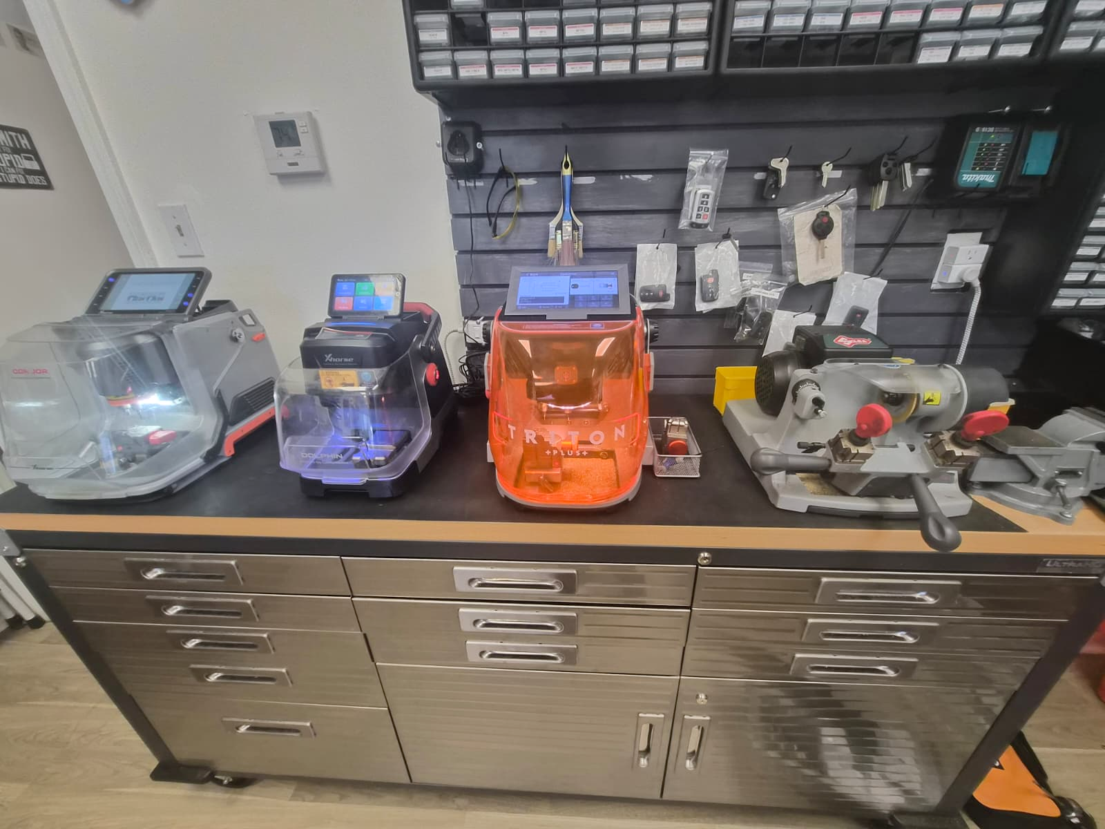 Key-cutting machines on the workbench at the ARD Locksmith shop