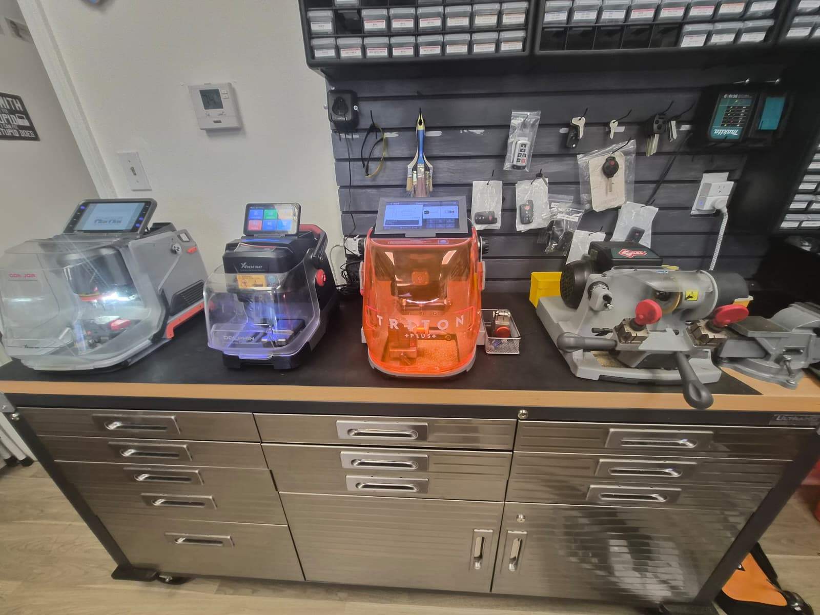 Key-cutting machines on the workbench at the ARD Locksmith shop